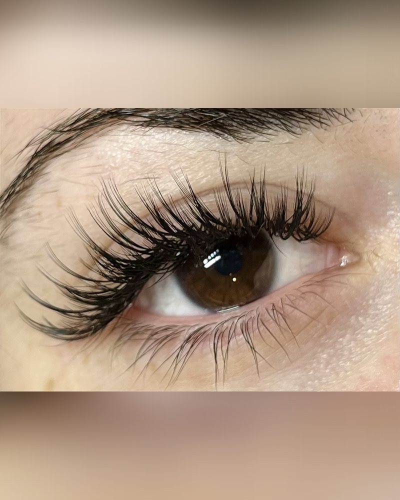 Wispy texture lash set close up on a brown eye